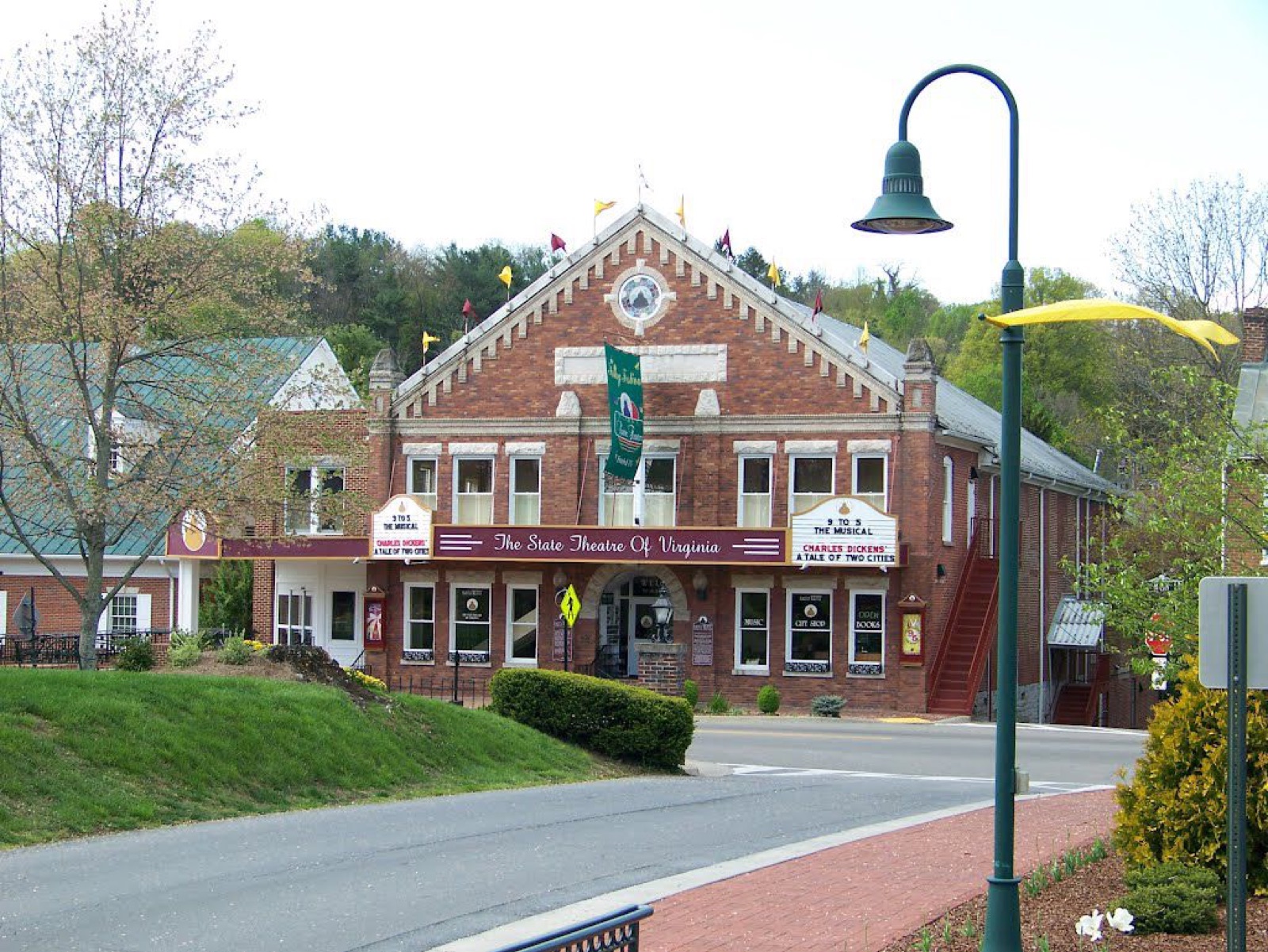 The brick facade of the Barter Theatre on Main Street in Abingdon, Virginia, amid the historic storefronts of the mountain town.
