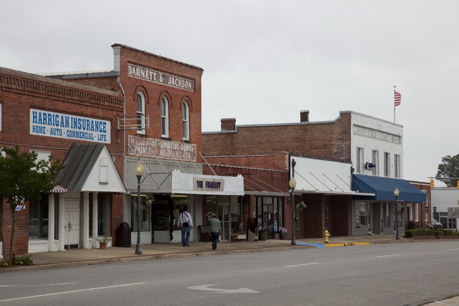 Historic brick storefronts along the courthouse square in downtown Monroeville, Alabama.