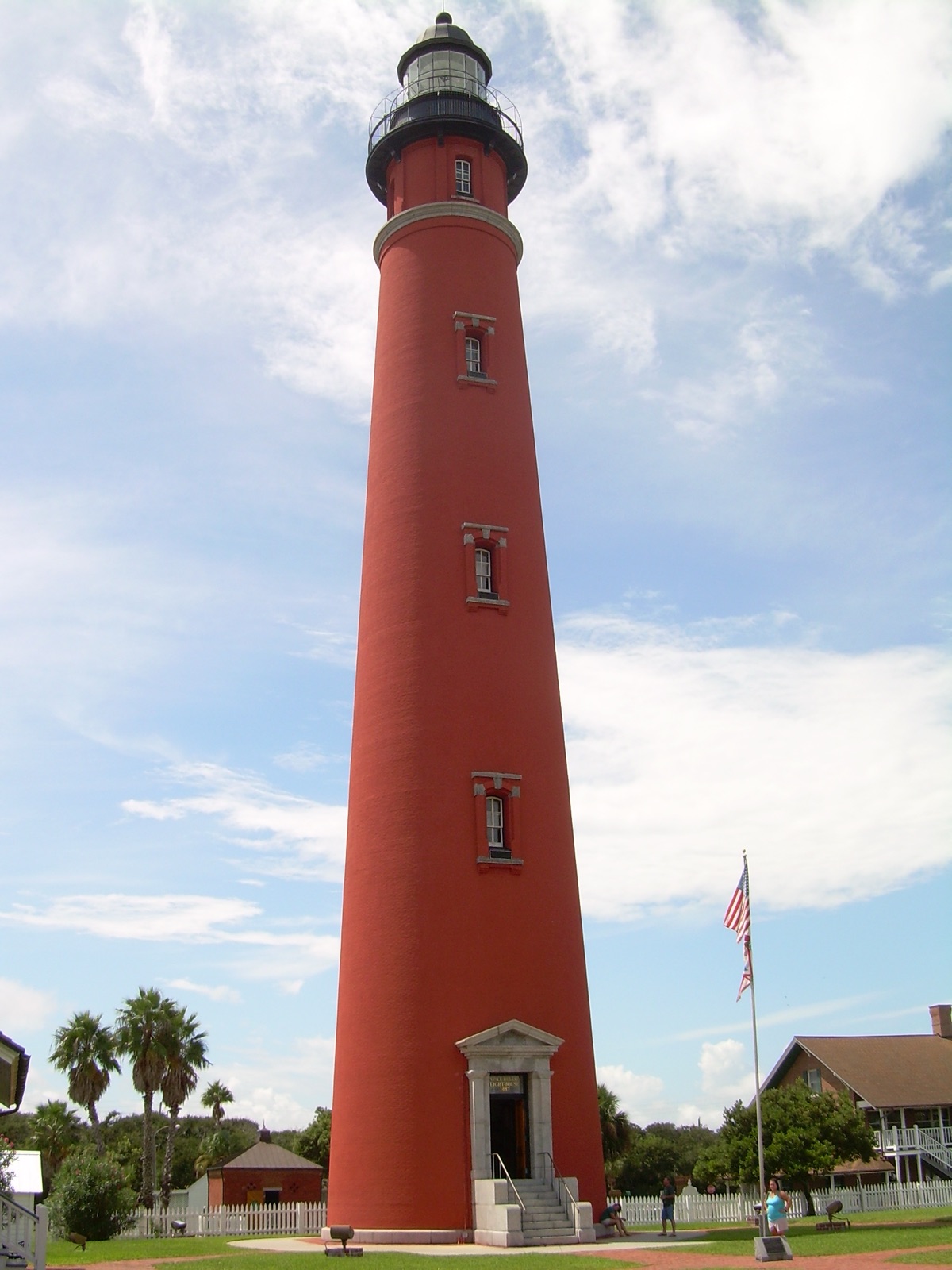 The tall red-brick Ponce de Leon Inlet Lighthouse rising above the central Florida coast.
