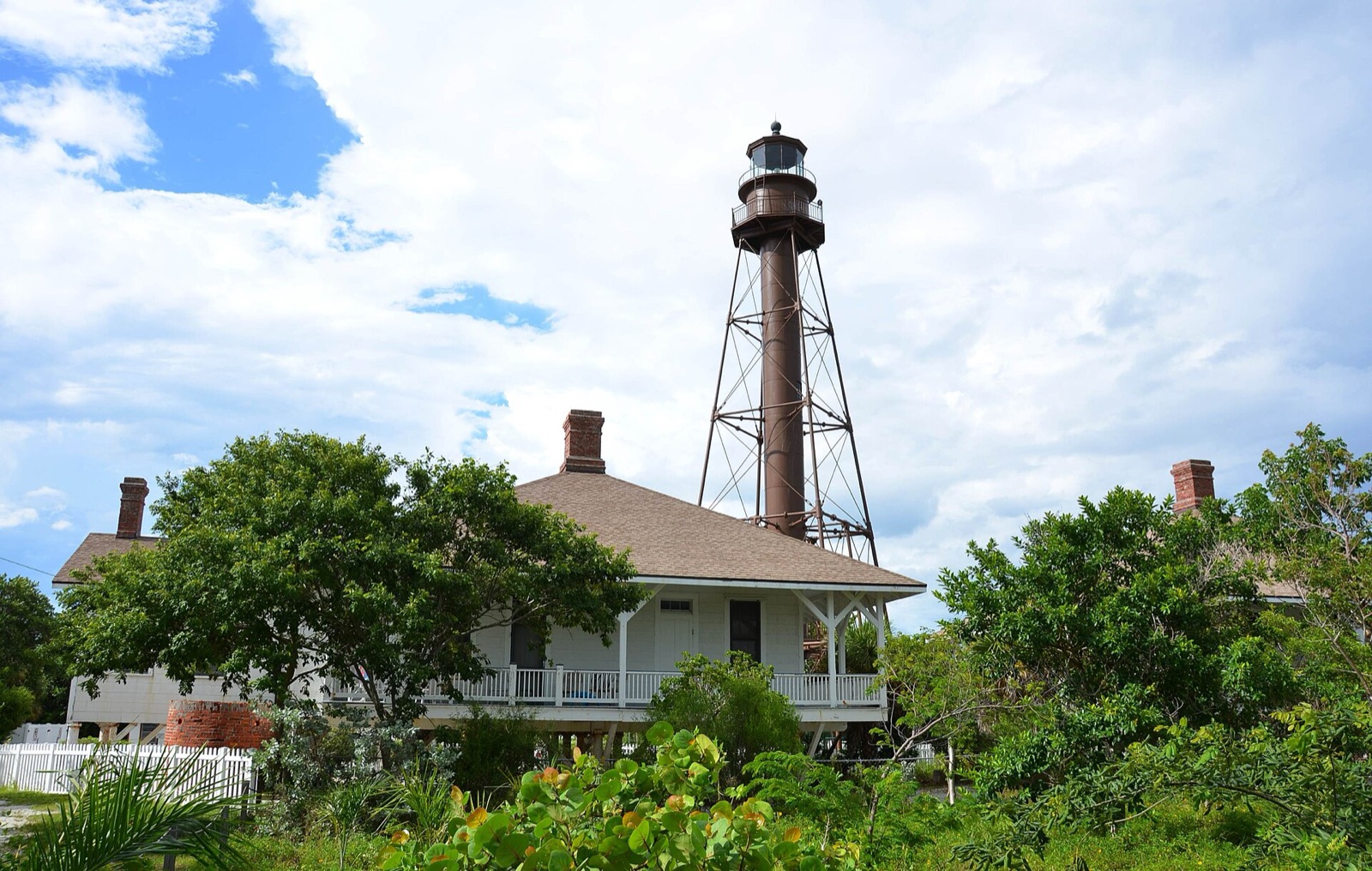 The brown iron-skeleton Sanibel Island Lighthouse among the palms on Sanibel Island, Florida.