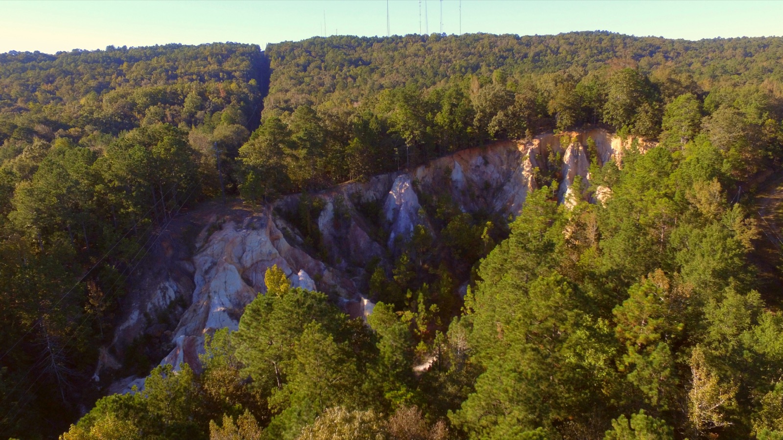 The wooded ridges of the Wetumpka meteor impact crater rising around the town.